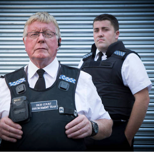 bailiffs wearing police-like body armour